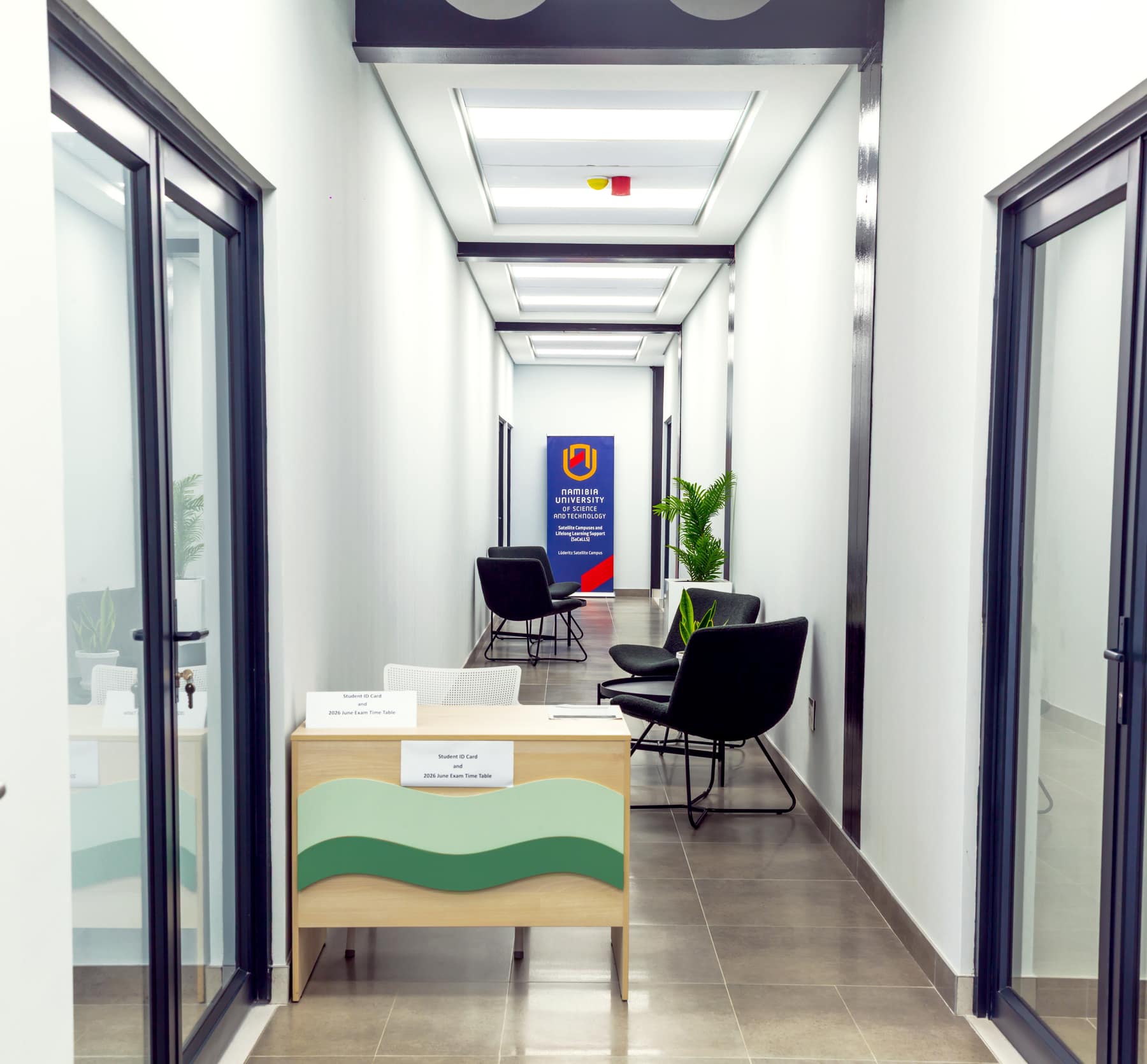 Corridor and waiting area at the Namibia University of Science and Technology, lit by recessed ceiling panels